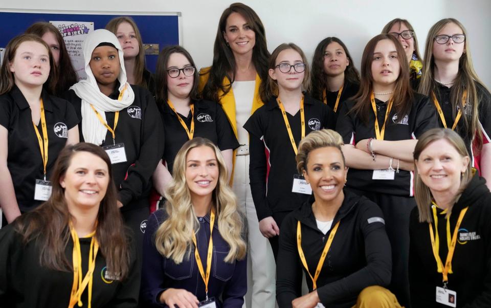 The Princess of Wales poses with Dame Kelly Holmes and pupils from St Katherine's School in Bristol at a youth development charity event in Bath - AP/AP