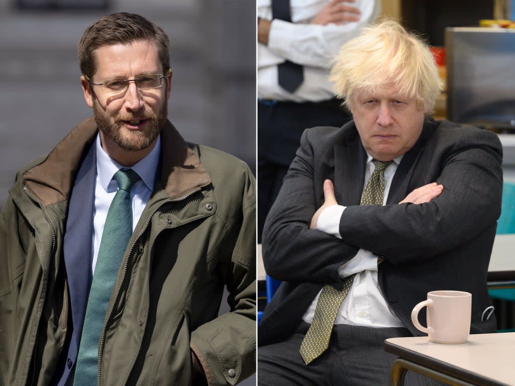 Simon Case, left, and Boris Johnson  (Getty)