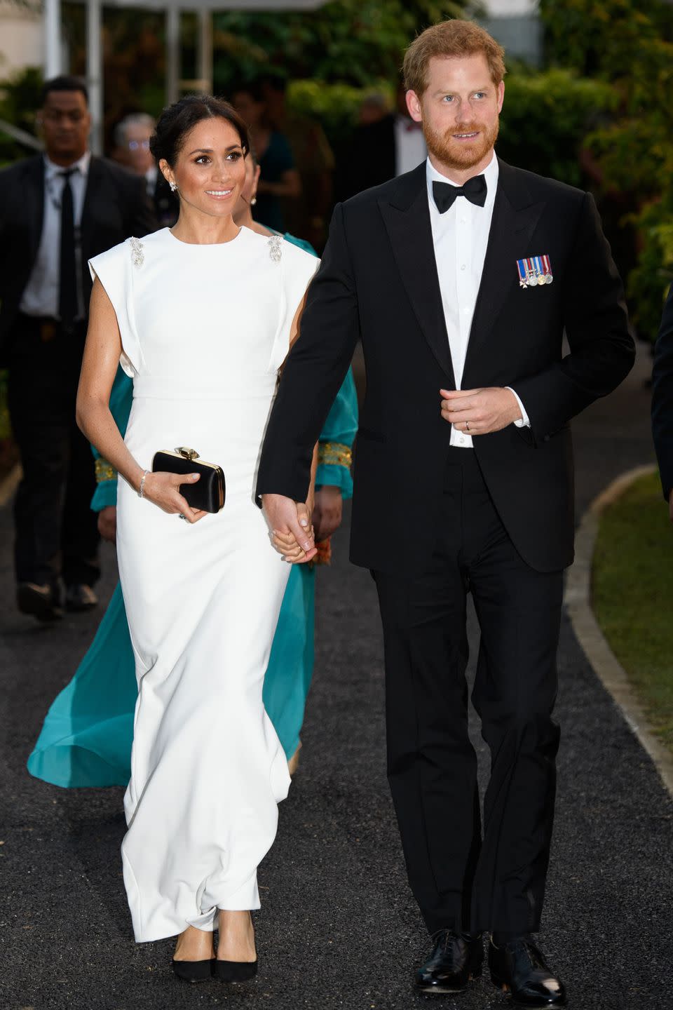 <p><strong>October 2018 </strong>The duchess dressed up for a formal event during their autumn tour, in a Theia ivory gown. </p>