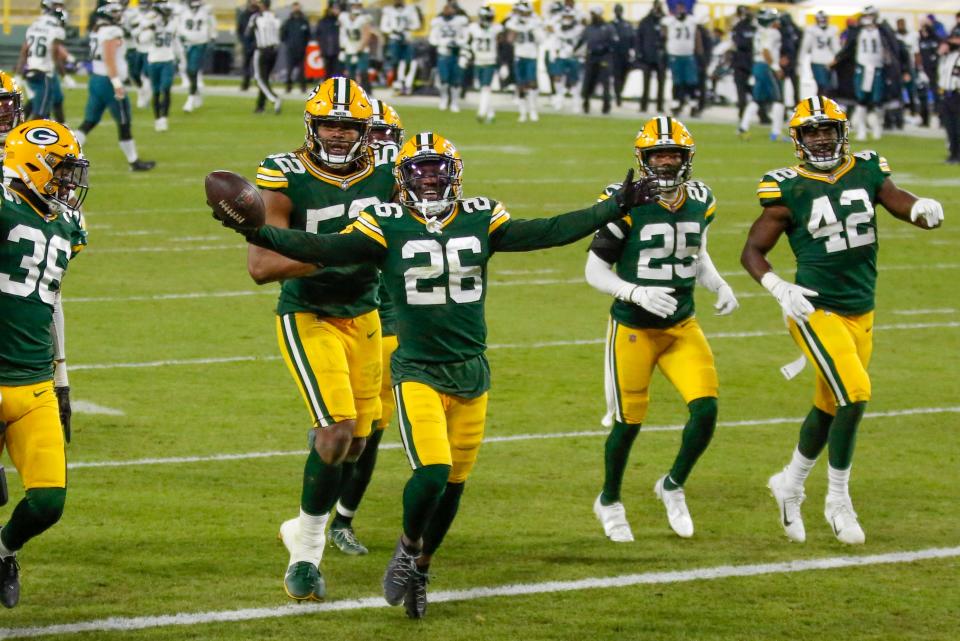 Green Bay Packers' Darnell Savage celebrates with teammates after his interception during the second half of an NFL football game against the Philadelphia Eagles Sunday, Dec. 6, 2020, in Green Bay, Wis. The Packers won 30-16. (AP Photo/Matt Ludtke)