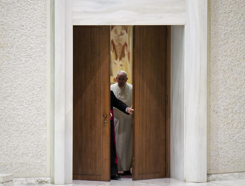 Pope Francis arrives to attend his weekly general audience in the Paul VI Hall at the Vatican, Wednesday, Jan. 26, 2022. (AP Photo/Alessandra Tarantino)