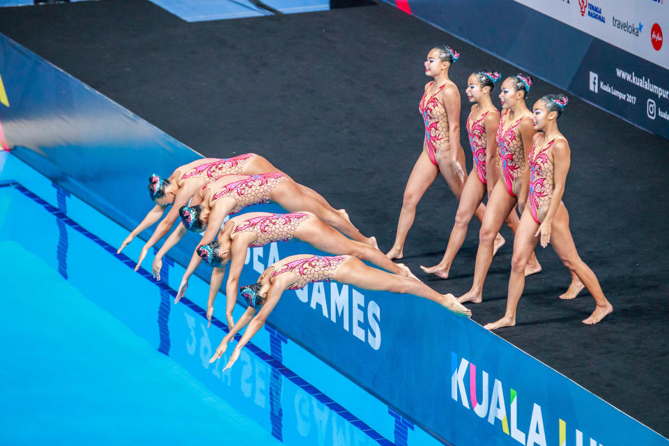 <p>Team Singapore performs during the synchronised swimming team free event on 20 Aug. Singapore won gold in the event, Malaysia took the silver and Indonesia bronze. Photo: Stanley Cheah/SportSG </p>