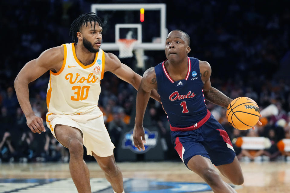 Florida Atlantic guard Johnell Davis (1) brings the ball up court as Tennessee guard Josiah-Jordan James (30) defends during the second half of a Sweet 16 college basketball game in the East Regional of the NCAA tournament at Madison Square Garden, Thursday, March 23, 2023, in New York. (AP Photo/Frank Franklin II)