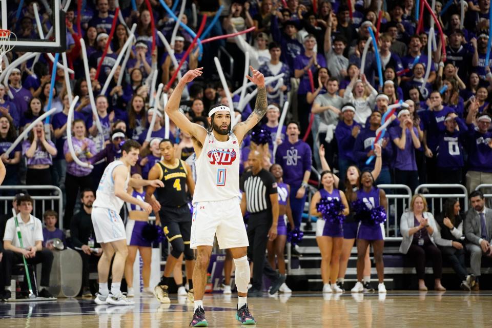 Northwestern Wildcats guard Boo Buie (0) gestures after making a 3-point basket against the Michigan Wolverines during the first half at Welsh-Ryan Arena in Evanston, Illinois, on Thursday, Feb. 22, 2024.