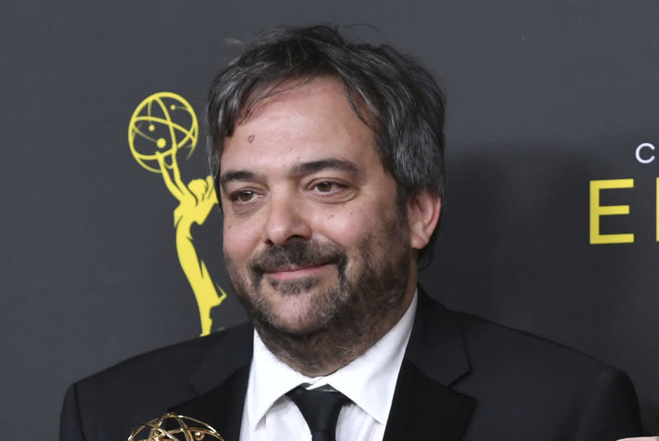 FILE - This Sept. 14, 2019 file photo shows Adam Schlesinger, winner of the awards for outstanding original music and lyrics for "Crazy Ex Girlfriend," in the press room at the Creative Arts Emmy Awards in Los Angeles. Schlesinger, an Emmy and Grammy winning musician and songwriter known for his band Fountains of Wayne and his songwriting on the TV show “Crazy Ex-Girlfriend,” has died from coronavirus at age 51. (Photo by Richard Shotwell/Invision/AP, File)