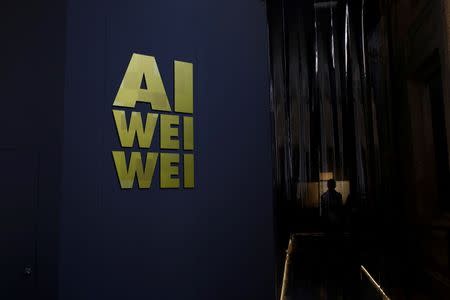 A man stands at the entrance to the "S.A.C.R.E.D" installation by Chinese artist Ai Weiwei during a media preview at the cathedral in Cuenca, Spain, July 21, 2016. Picture taken July 21, 2016. REUTERS/Susana Vera