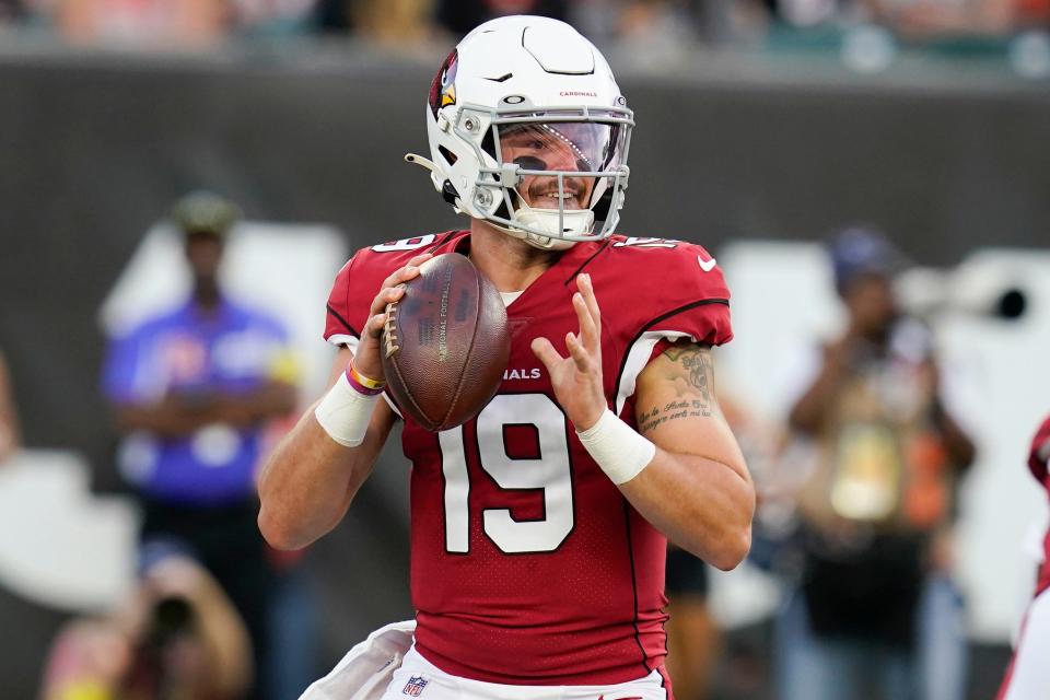 Arizona Cardinals quarterback Trace McSorley looks for a receiver during the team's NFL football preseason game against the Cincinnati Bengals in Cincinnati, Friday, Aug. 12, 2022. (AP Photo/Michael Conroy)