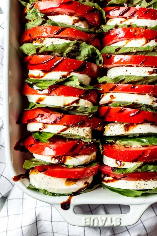 <p>Little Broken</p><p>Have this tomato mozzarella salad with balsamic reduction as an appetizer or serve it alongside your favorite entree (or on top of a crusty slice of bread for a light meal). Any way is awesome.</p><p><strong>Get the recipe: <a href="https://www.littlebroken.com/tomato-mozzarella-salad-with-balsamic-reduction/" rel="nofollow noopener" target="_blank" data-ylk="slk:Tomato Mozzarella Salad with Balsamic Reduction;elm:context_link;itc:0;sec:content-canvas" class="link ">Tomato Mozzarella Salad with Balsamic Reduction</a></strong></p>