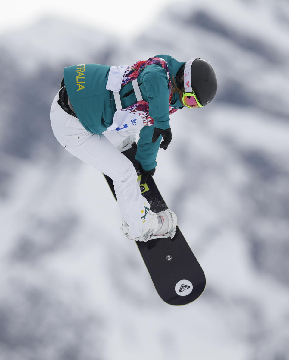 Australia's Torah Bright takes a jump in her first run in the women's snowboard slopestyle final at the 2014 Winter Olympics, Sunday, Feb. 9, 2014, in Krasnaya Polyana, Russia. (AP Photo/Andy Wong)