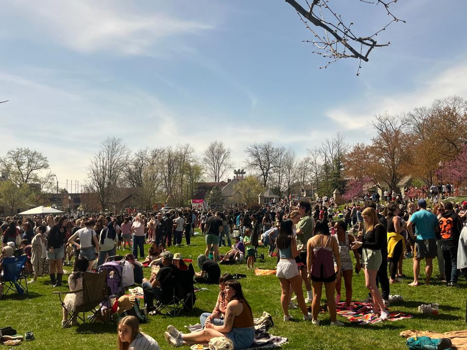 Hundreds of tourists, students and local residents gathered at Dunn Meadow on April 8, 2024, to witness a total solar eclipse.