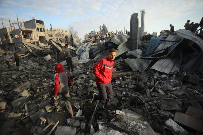 Palestinians search for victims at the site of an Israeli strike on a mosque in Rafah in the southern Gaza Strip on Wednesday. Photo by Ismael Mohamad/UPI