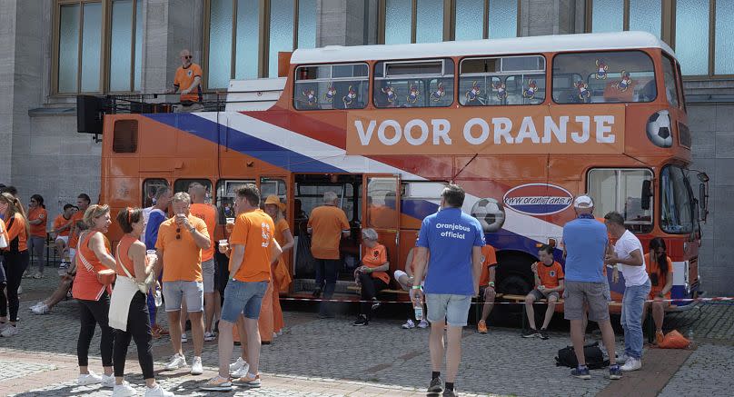 Henk van Beek walking towards the Oranje bus in Berlin.