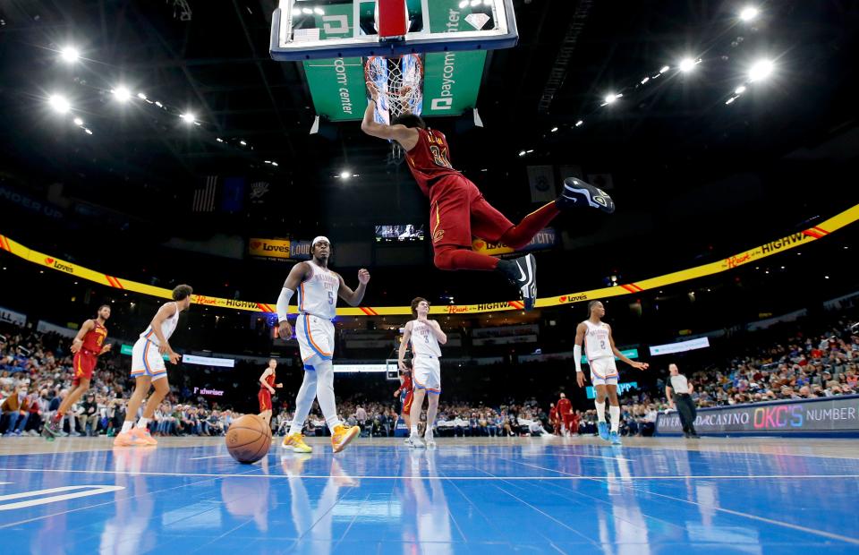 Cleveland's Ed Davis (21) dunks the ball in front of Oklahoma City's Luguentz Dort (5) in the second half during the NBA game between the Oklahoma City Thunder and the Cleveland Cavaliers at the Paycom Center in Oklahoma City, Saturday, Jan. 15, 2022. 