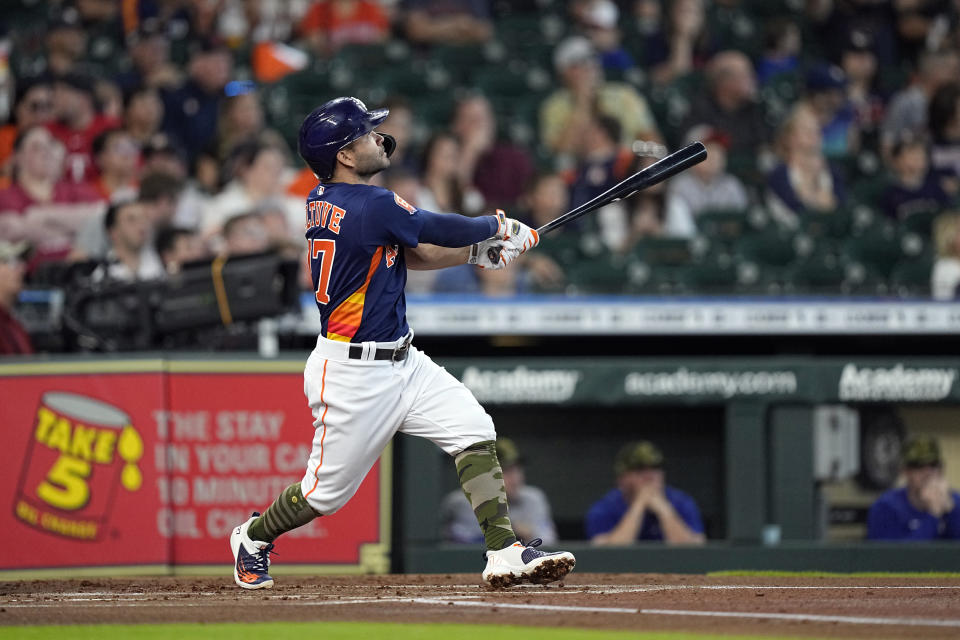 Houston Astros' Jose Altuve hits a home run during the first inning of a baseball game against the Texas Rangers Sunday, May 22, 2022, in Houston. (AP Photo/David J. Phillip)