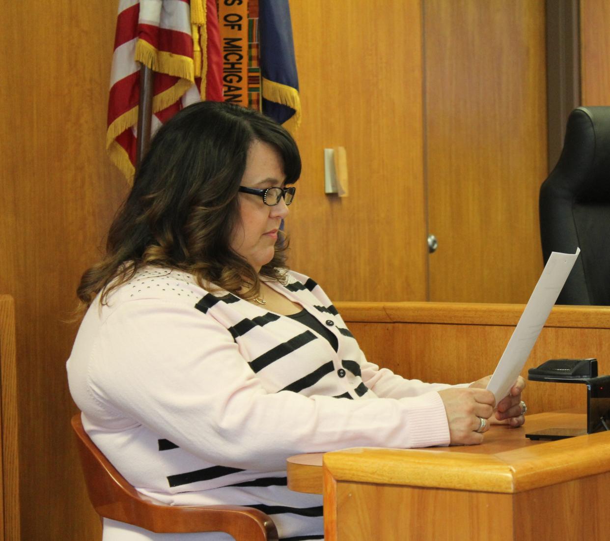 Livingston County GOP Chairperson Jennifer Smith reviews at exhibit in the Washtenaw County 22nd Circuit Court on Tuesday, March 21, 2023.