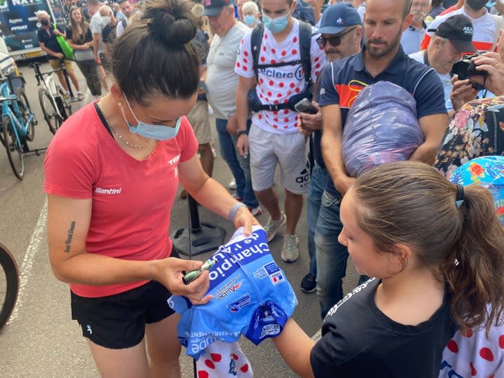 <span class="article__caption">Cordon Ragot signs autographs before stage 4 of the Tour de France Femmes in Troyes, France</span> (Photo: Betsy Welch)