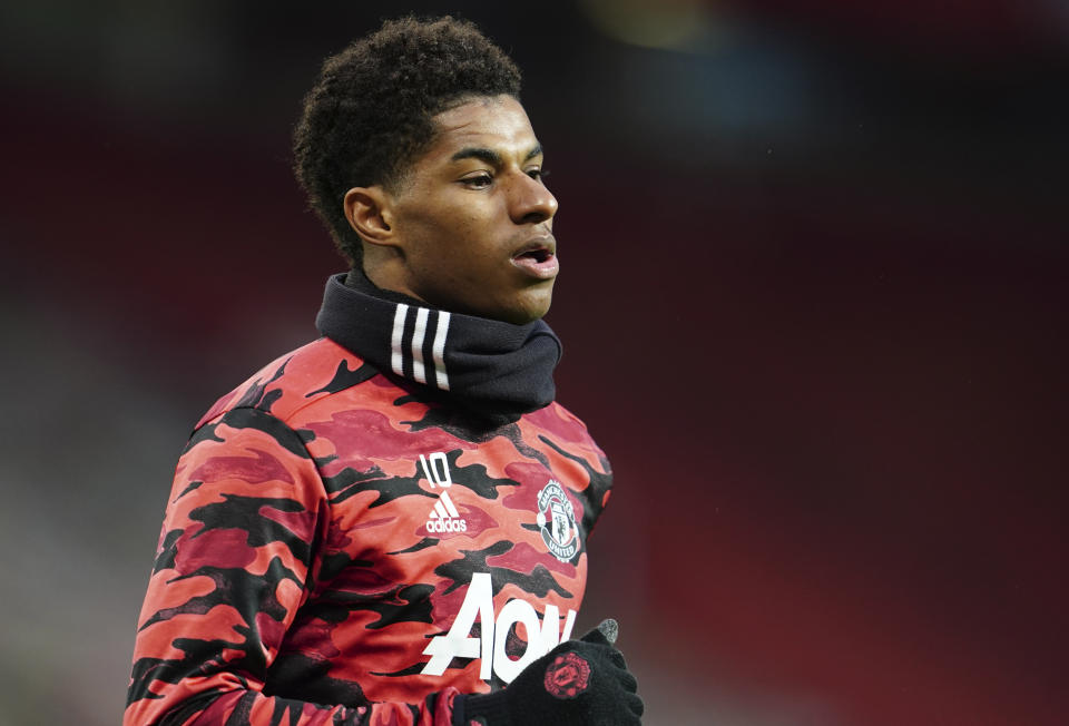 FILE - In this Thursday, April 29, 2021 file photo, Manchester United's Marcus Rashford warms up before the Europa League semifinal, first leg soccer match between Manchester United and Roma at Old Trafford in Manchester, England. Manchester United striker Marcus Rashford will undergo shoulder surgery and is expected to be sidelined for an extended period of rehabilitation. (AP Photo/Jon Super, File)