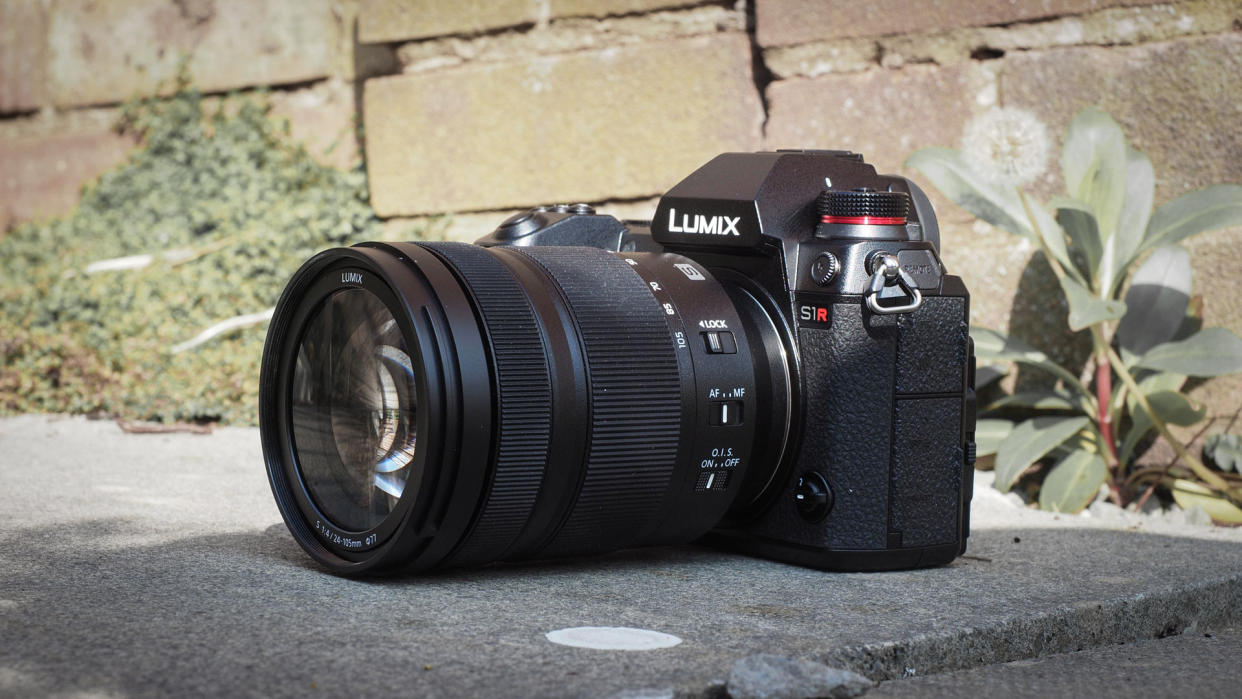  Panasonic Lumix S1R outdoors against a brick wall. 