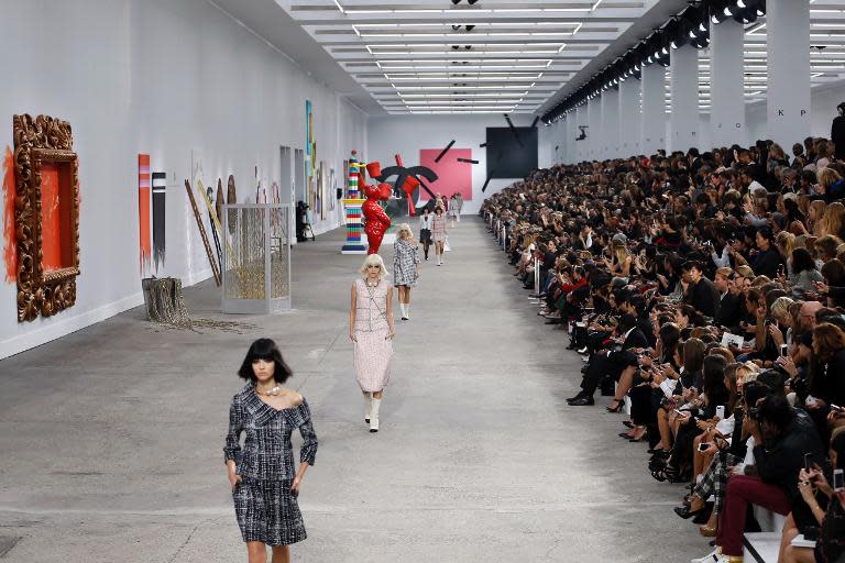 Models present creations for Chanel during the 2014 Spring/Summer ready-to-wear collection fashion show, on October 1, 2013 at the Grand Palais in Paris