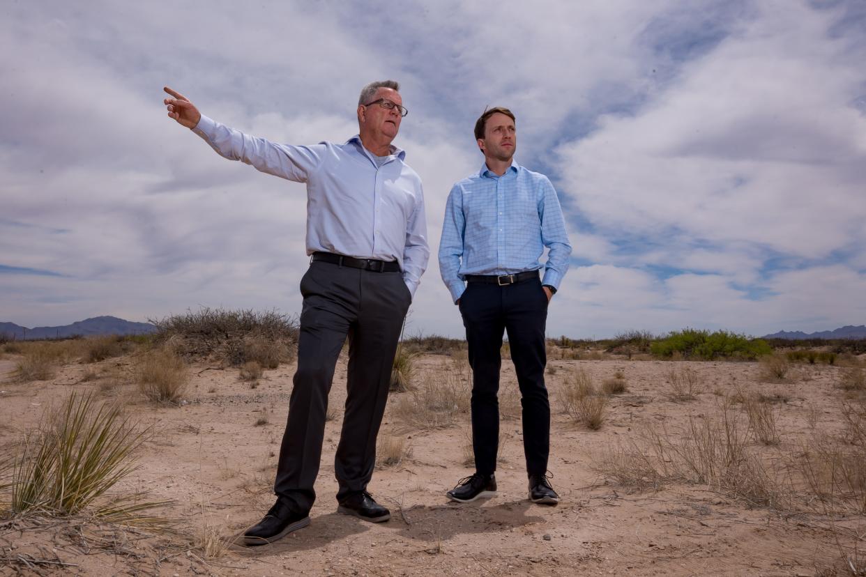 Terry McLachlan, left, and his son Devon McLachlan, Dallas-area developers, stand April 24, 2024 on the vacant land where the 1,180-acre Alta Mesa Estates will be developed in Santa Teresa, New Mexico.