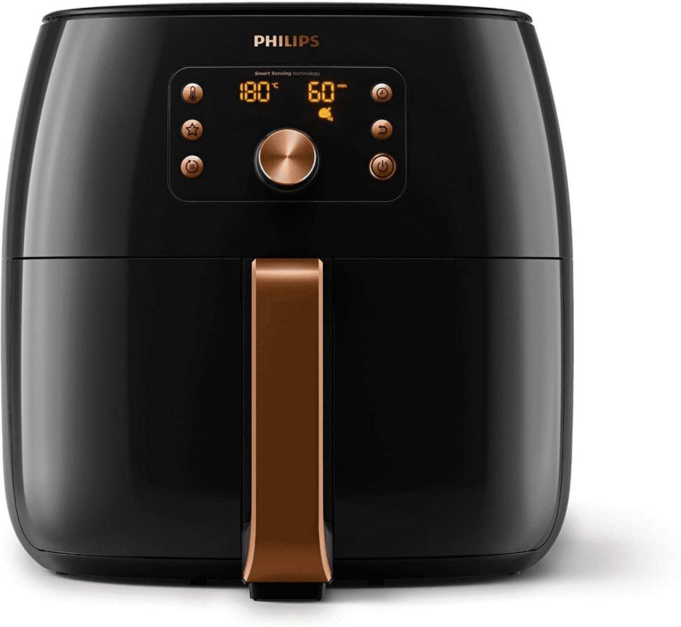 The Philips Premium Collection Air Fryer XXL in black and copper on a white background