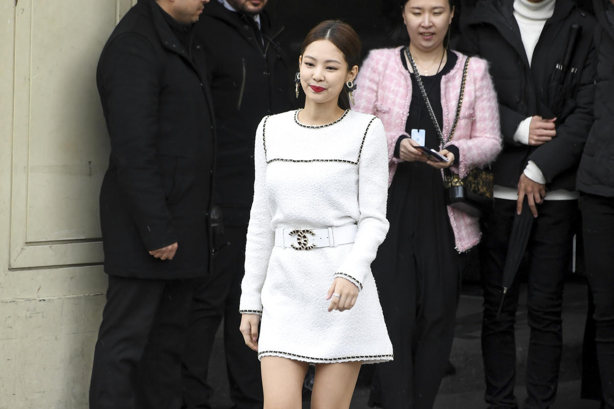 Chanel Ambassador Jennie Kim in a red crop top and skirt at Chanel