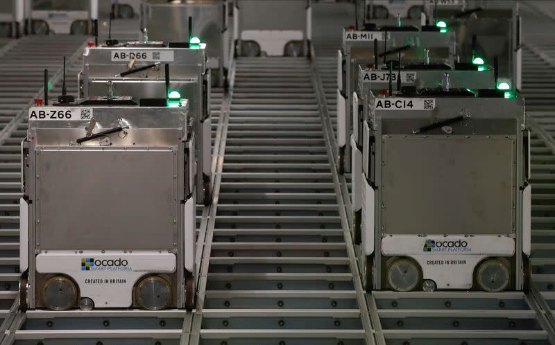 Ocado robots are seen inside a warehouse in Erith