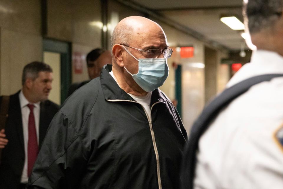 Allen Weisselberg enters Manhattan criminal court on 10 April (AP)