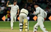 Australia's Joe Burns is bowled by New Zealand paceman Doug Bracewell during the day-night Test at the Adelaide Oval on November 27, 2015