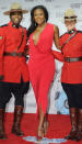 Jully Black shows off her curves in a gorgeous red wrap dress and silver bow sandal heels. THE CANADIAN PRESS/Sean Kilpatrick