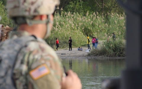 A wire barrier has been created on the river bank of the Rio Grande River, on the border between Texas and Nuevo Laredo, Mexico - Credit: Thomas Watkins/AFP