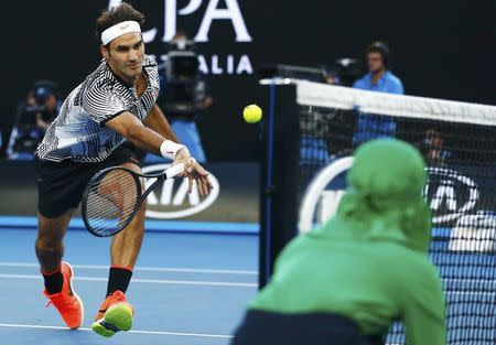 Tennis - Australian Open - Melbourne Park, Melbourne, Australia - 24/1/17 Switzerland's Roger Federer hits a shot during his Men's singles quarter-final match against Germany's Mischa Zverev. REUTERS/Thomas Peter