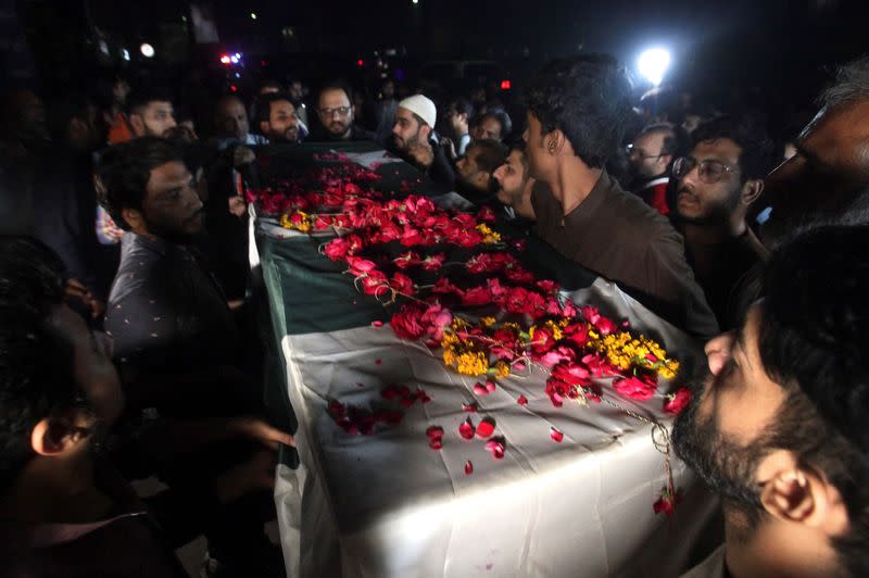 People attend the funeral of Sadaf Naeem, a female journalist who was killed by a vehicle carrying former prime minister Imran Khan in an accident, in Lahore