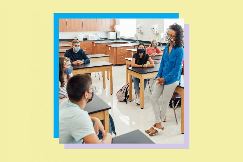 An image of a teacher with teenage students.