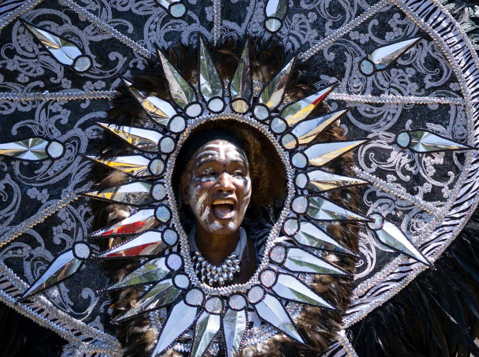 <p>A person in masquerade passes by while participating in the West Indian American Day Parade in the Brooklyn borough of New York Monday, September 3, 2018. (AP Photo/Craig Ruttle) </p>