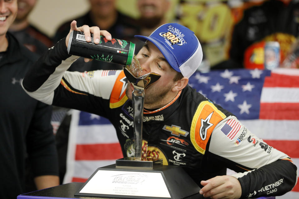 Noah Gragson celebrates his win after a NASCAR Xfinity Series auto race at Kansas Speedway in Kansas City, Kan., Saturday, Sept. 10, 2022. The race was called after 93 laps due to rain. (AP Photo/Colin E. Braley)