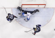<p>The puck shot by Jocelyne Lamoureux-Davidson, of the United States, sails past goalie Noora Raty (41), of Finland, for a goal during the second period of the semifinal round of the women’s hockey game at the 2018 Winter Olympics in Gangneung, South Korea, Monday, Feb. 19, 2018. (AP Photo/Matt Slocum) </p>
