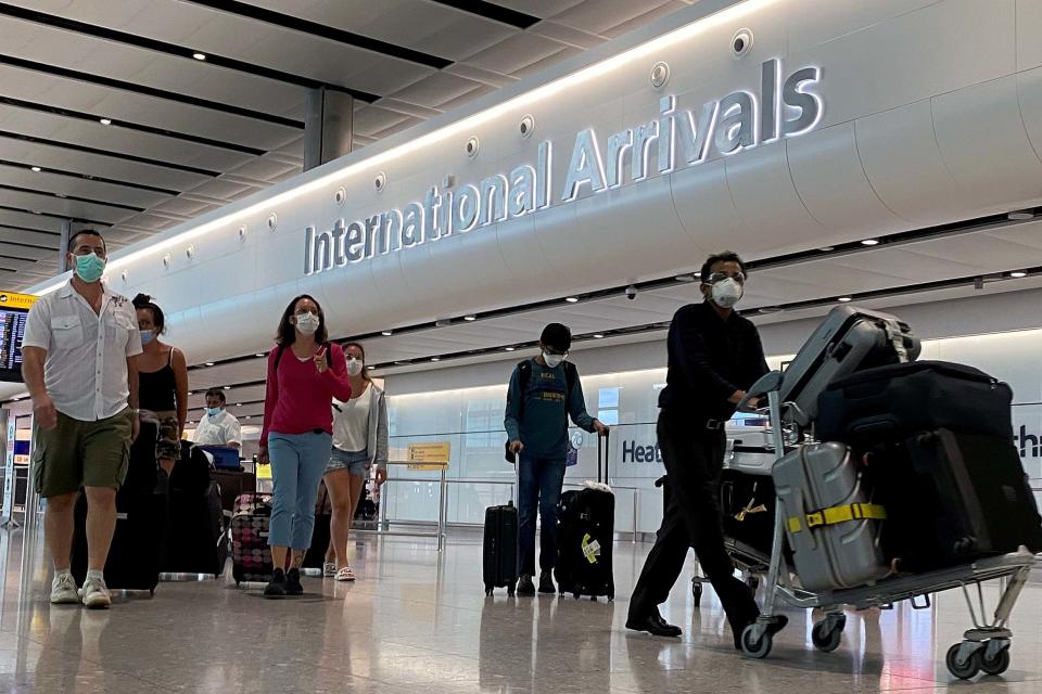 Passengers from international flights arrive at Heathrow Airport (REUTERS)