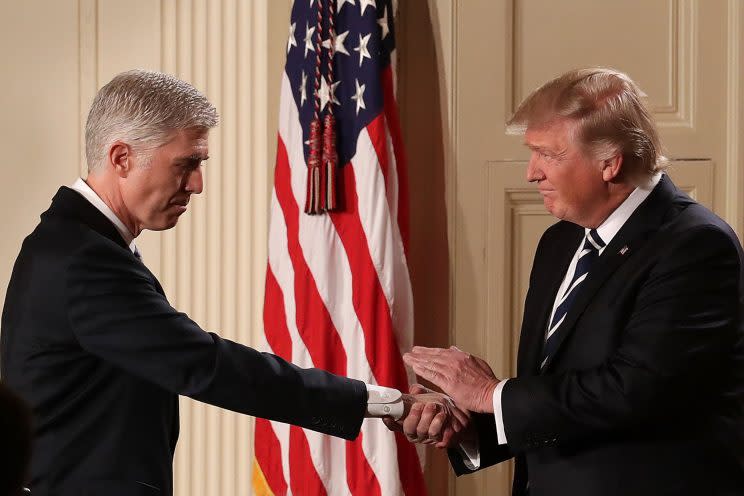 Neil Gorsuch, Donald Trump’s Supreme Court nominee, shakes hands with the President after the announcement. (Photo: Getty Images)