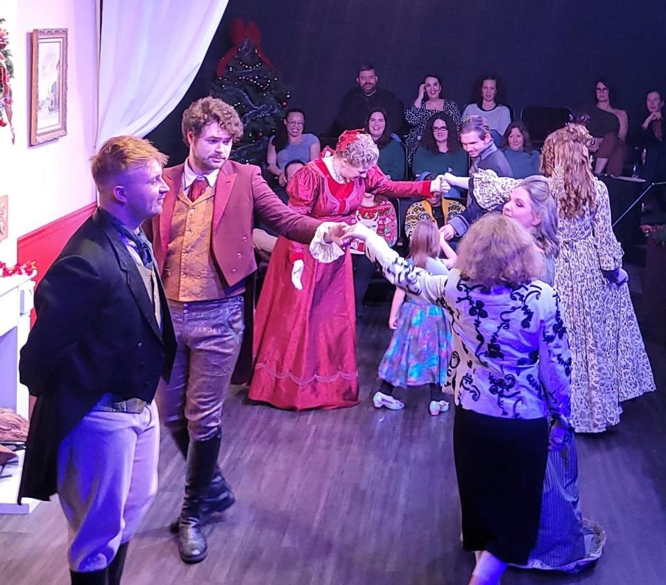 Regan Rodgers, left, playing Mr. Darcy, dances with Brenna McDonnell, the daughter of The Oklahoman Features Writer Brandy McDonnell, while Tyler John Malinauskas, playing Edward Ferrars, looks on during opening night for Oklahoma Shakespeare in Park's new production of "Jane Austen's Christmas Cracker" Dec. 9, 2022.