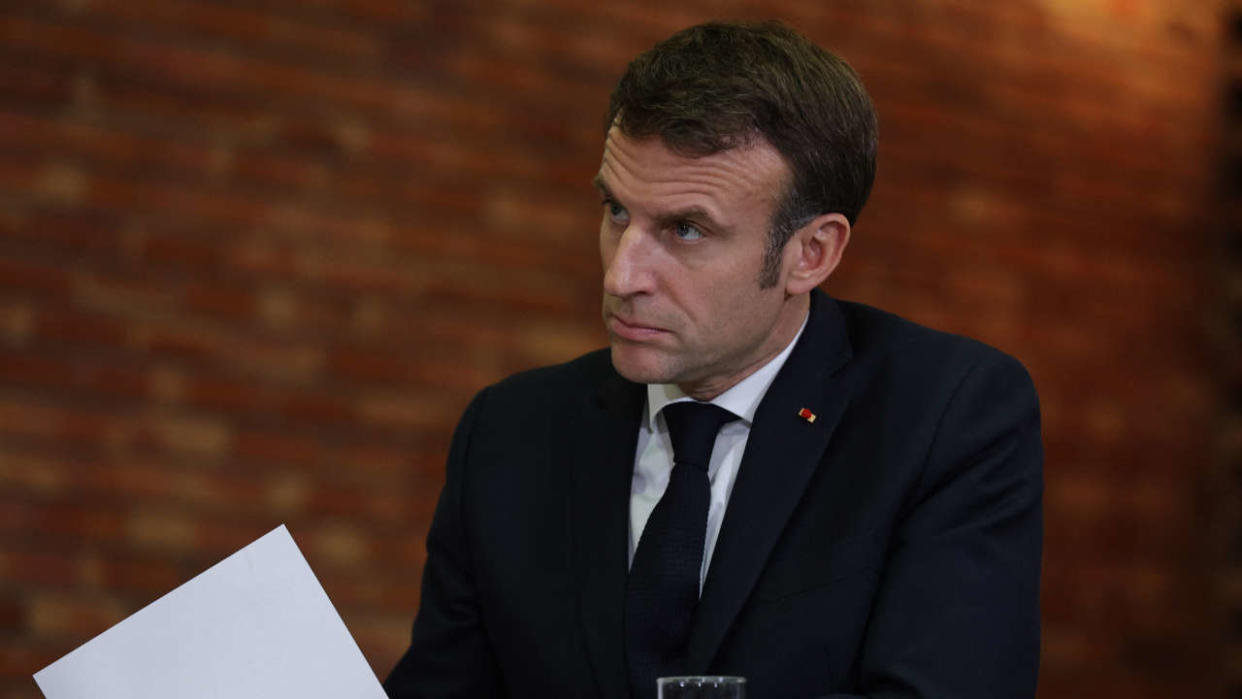 France's President Emmanuel Macron attends a meeting with Justice workers at the courthouse of Dijon, eastern France, on November 25, 2022 as part of the events to mark the International Day for the Elimination of Violence Against Women. (Photo by Christophe PETIT TESSON / POOL / AFP)