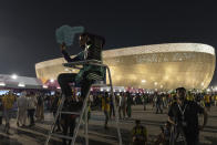 Osama, 21 years-old, from Palestine works as a street marshal prior to the World Cup group G soccer match between Brazil and Serbia, at the Lusail Stadium in Lusail, Qatar, Thursday, Nov. 24, 2022. The World Cup 2010 in South Africa had Shakira. The 1998 World Cup in France had Ricky Martin. In Qatar, the tune that nests itself in the head is the incessant chanting of street marshals, better knows as Last Mile Marshals. Seated all over Doha on high chairs more commonly used by lifeguards at swimming pools, these migrant workers have become a staple of the Middle East's first World Cup. (AP Photo/Moises Castillo)