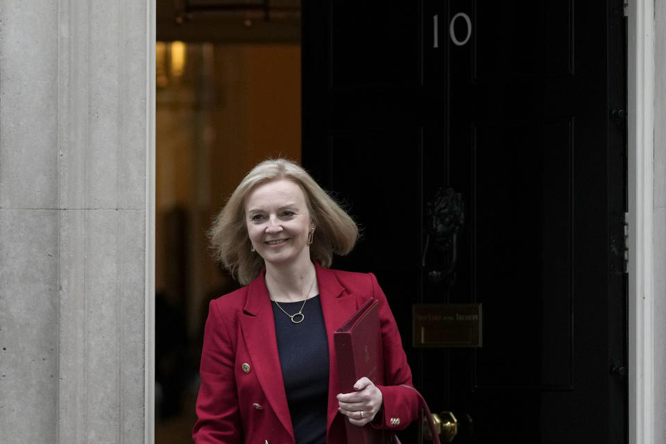 FILE - Liz Truss, Britain's Foreign Secretary, leaves 10 Downing Street after a Cabinet meeting held ahead of the Budget being delivered by the Chancellor of the Exchequer Rishi Sunak in London, Oct. 27, 2021. Revelations that Prime Minister Boris Johnson and his staff partied while Britain was in a coronavirus lockdown have provoked public outrage and led some members of his Conservative Party to consider ousting their leader. If they manage to push Johnson out — or if he resigns — the party would hold a leadership contest to choose his replacement. Truss, 46, took on the high-profile job of foreign secretary in September after serving as trade minister and has been gaining momentum as a contender since. (AP Photo/Alastair Grant, File)