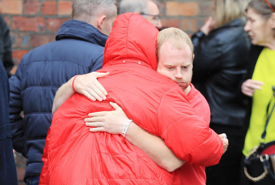 Families of victims leaving Parr Hall, Warrington