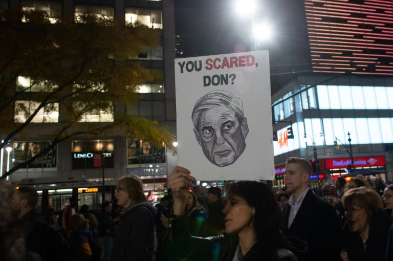 Protesters in New York brandish a portrait of special counsel Robert Mueller -- who heads the probe into alleged improper links between Donald Trump, his 2016 election campaign and the Kremlin