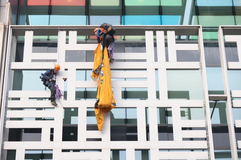 Activists from Animal Rebellion after scaling the outside of the Defra building in Westminster (James Manning/PA) (PA Wire)