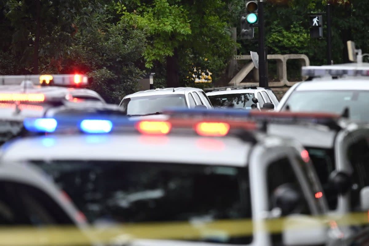 FILE - Police block off a road near the National Zoo in Washington, DC, on August 29, 2023, after a bomb threat caused the zoo to be evacuated.   (AFP via Getty Images)