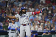 Toronto Blue Jays' Vladimir Guerrero Jr. reacts after a check swing against Philadelphia Phillies pitcher Spencer Turnbull during the eighth inning of a baseball game, Tuesday, May 7, 2024, in Philadelphia. (AP Photo/Matt Slocum)