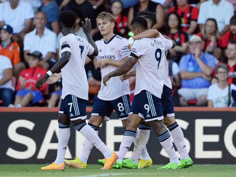 Martin Oedegaard of Arsenal celebrates with teammate after scoring their team's second goal during the Premier League match between AFC Bournemouth and Arsenal FC at Vitality Stadium.