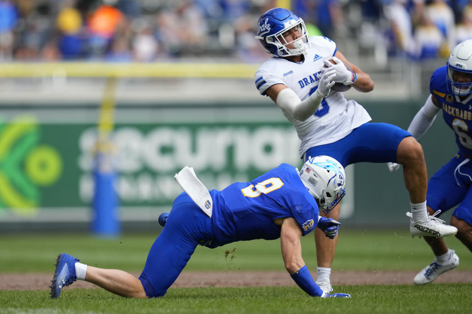 Drake running back Dorian Boyland, front right, is tackled by South Dakota State linebacker Caleb Francl during the first half of an NCAA college football game Saturday, Sept. 16, 2023, in Minneapolis. (AP Photo/Abbie Parr)